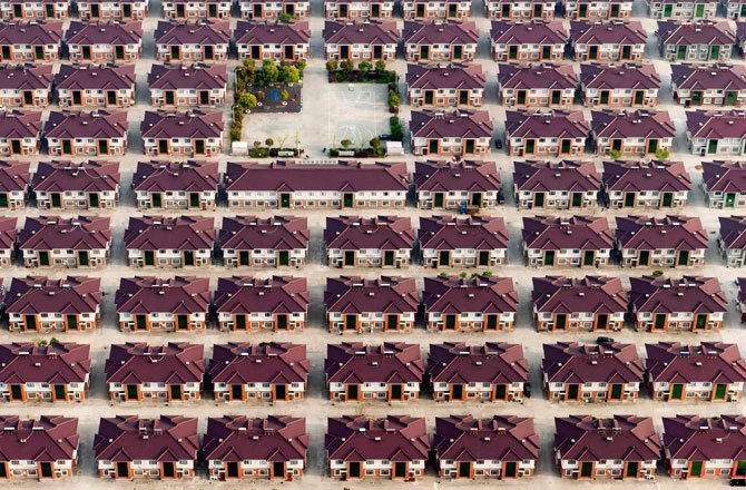 26.Rows of identical houses and a playground in Jiangyin, a city in China's Jiangsu province. (Kacper Kowalski/2014 Sony World Photography Awards)