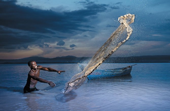 31.A fisherman in Lake Victoria casts his net near Kisumu, Kenya. (Allan Gichigi)