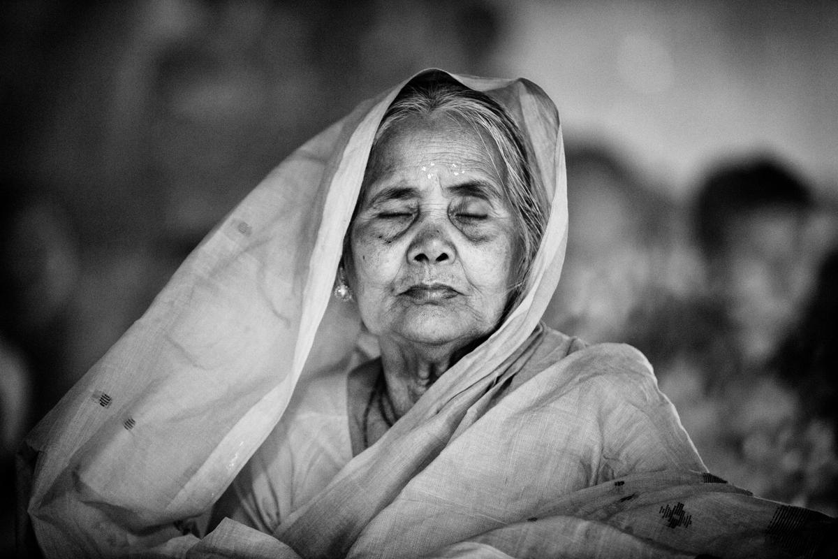 10.An old Hindu woman sits and prays in front of the Shri Shri Lokanath Brahmachar Ashram Temple during the Rakher Upobash at Barodi, Narayangonj. Hindu devotees fast and pray to gods during the ritual called Kartik Brati or Rakher Upobash. This image, taken by Suvra Kanti Das, has been shortlisted in the Arts and Culture category. (Suvra Kanti Das/Sony World Photography Awards)