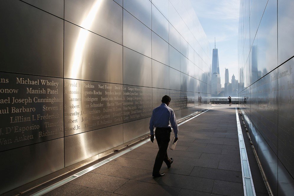 A Colombian immigrant walks through the New Jersey Empty Sky 9/11 Memorial after taking the oath of allegiance and becoming a U.S. citizen – Sept. 17, 2015.