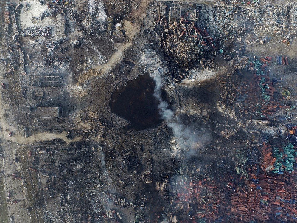 An aerial view of a large crater that was formed in the aftermath of a huge explosion that rocked the port city of Tianjin, China. At least 85 people were killed – Aug. 12, 2015.